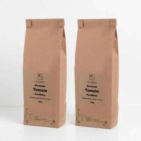 Organic Tomato Fertiliser — two 750g kraft bags labelled Dr Forest Premium Tomato Fertiliser, 100% Compostable