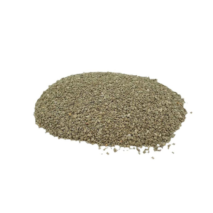 Pile of grey-green montmorillonite clay granules on white background — soil conditioner range