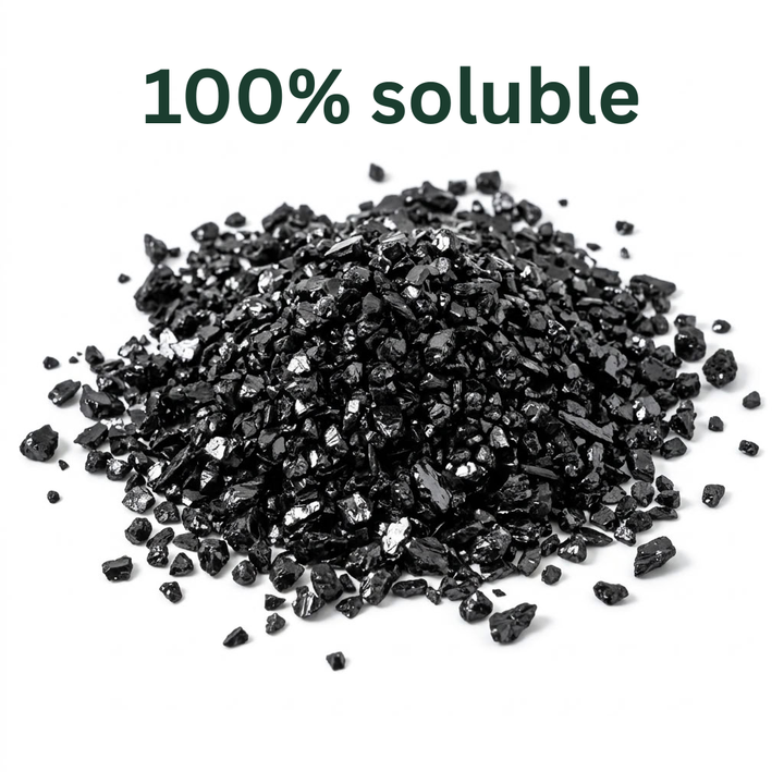Dr Forest soluble humic acid granules, a loose pile of angular black crystals, 100% soluble in water