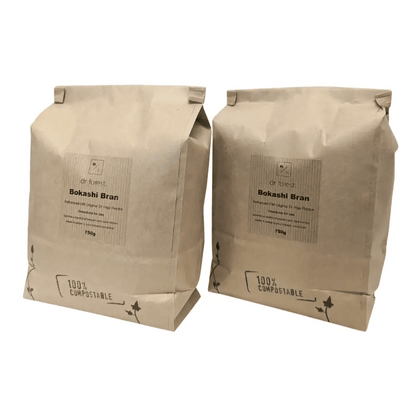 Organic Bokashi Bran — two 750g beige paper bags side by side, 100% Compostable mark with ivy graphic