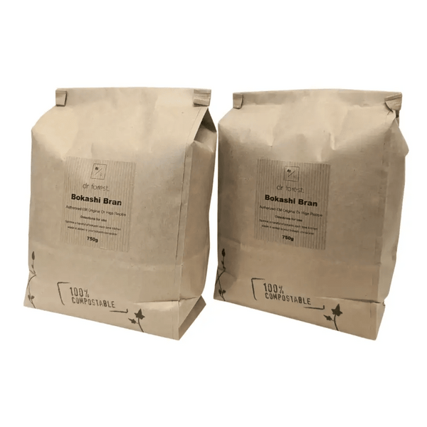 Organic Bokashi Bran — two 750g beige paper bags side by side, 100% Compostable mark with ivy graphic