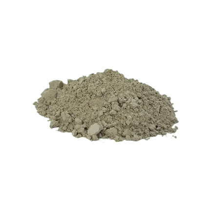 Volcanic Rock Dust — pile of fine grey-green basalt powder