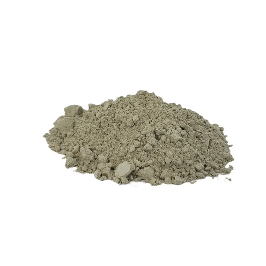 Volcanic Rock Dust — pile of fine grey-green basalt powder