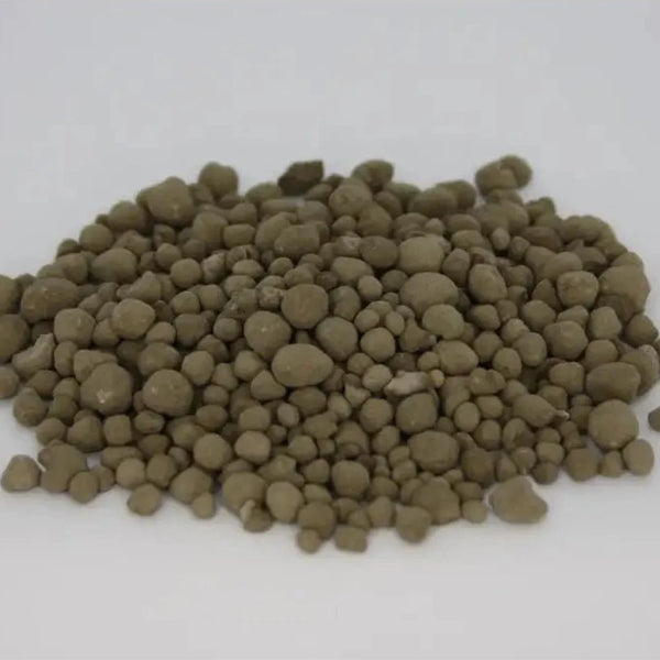 Granulated Volcanic Rock Dust — pile of olive-brown round mineral granules