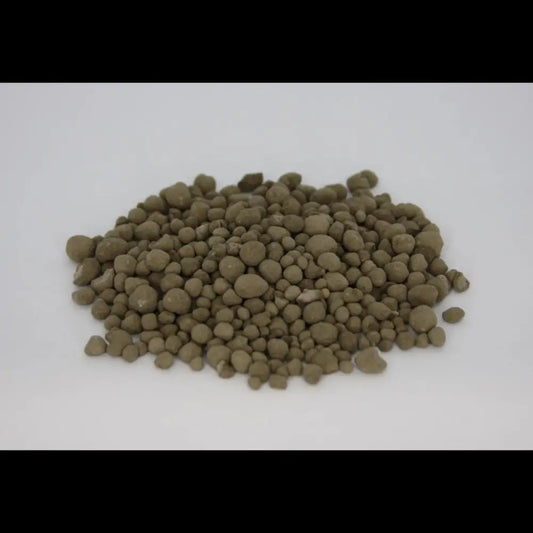 Granulated Volcanic Rock Dust — pile of olive-brown round mineral granules