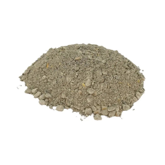 Organic Late Bloom Fertiliser — mound of pale-grey powder with small granules and grit