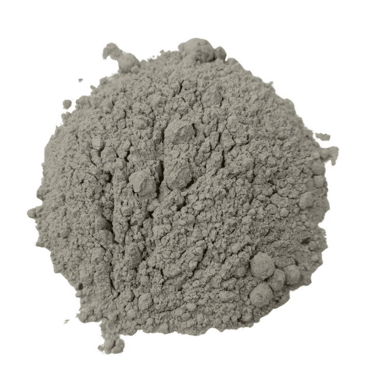 Dr Forest Mineral Mix, a mineral soil conditioner of basalt rock dust, gypsum, clay minerals and sea shell meal, poured in a mound