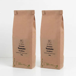 Organic Tomato Fertiliser — two 750g kraft bags labelled Dr Forest Premium Tomato Fertiliser, 100% Compostable