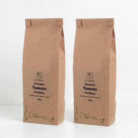 Organic Tomato Fertiliser — two 750g kraft bags labelled Dr Forest Premium Tomato Fertiliser, 100% Compostable