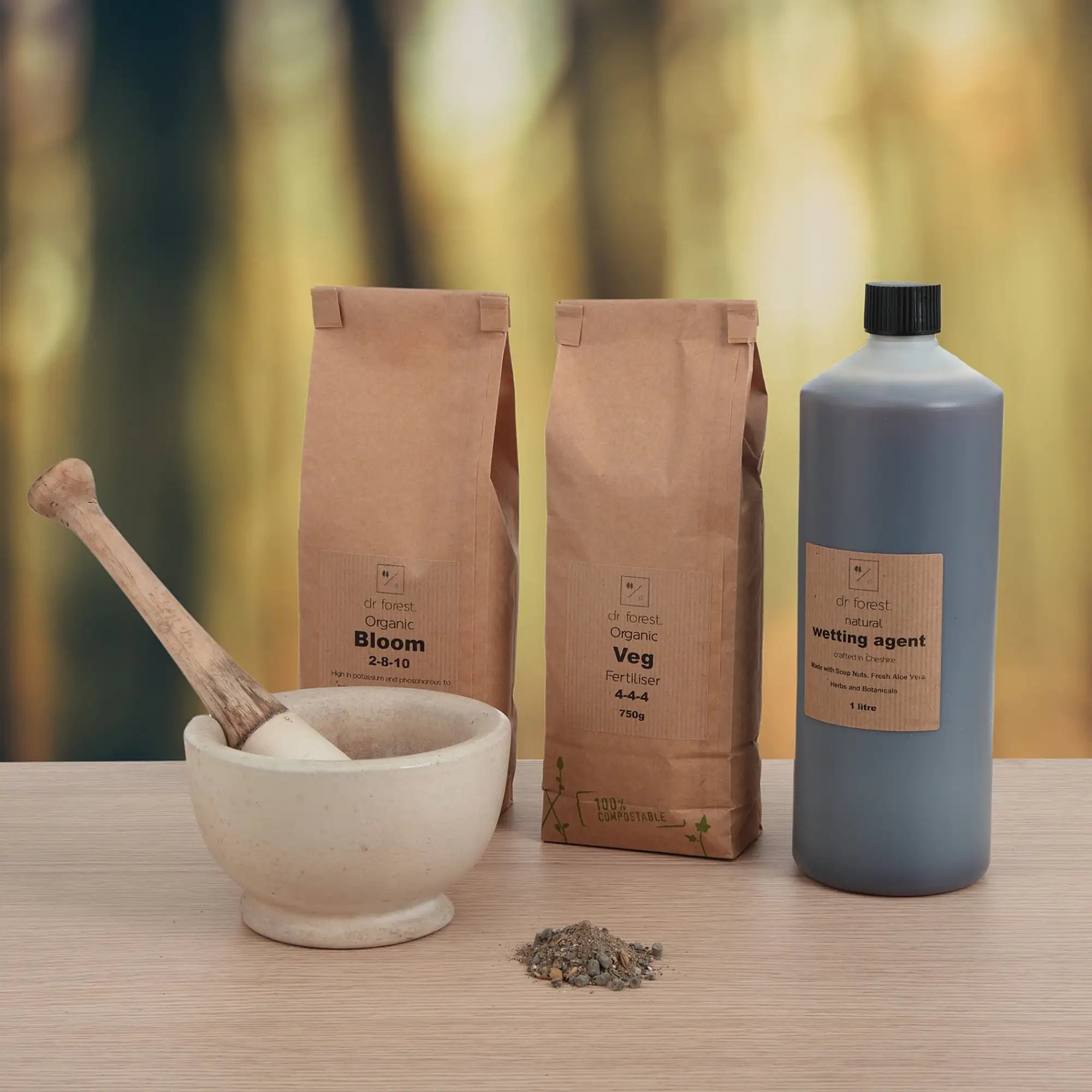 White mortar and pestle with wooden handle, natural stone base, rustic design.